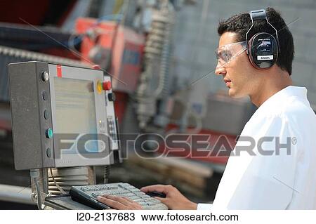 Stock Image - Machine for cutting material by water jet and abrasive. Industry. Technology and Research Centre. Technological Park, San Sebastian, Donostia, Gipuzkoa, Basque Country, Spain. Fotosearch