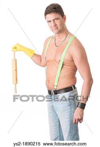 Macho man in suspenders holds rolling pin with negative expression View Large Photo Image Stock Photography - Macho man in suspenders holds rolling pin with negative expression. Fotosearch