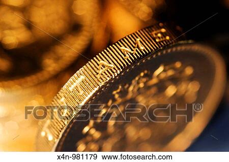 Stock Photo - Macro shot of British pound coins. Fotosearch