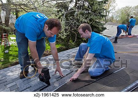 Stock Image Of Madison Heights Michigan Volunteers From Mercedes Madison Heights Michigan Volunteers From Mercedes Benz Financial Services Help Re Habilitate A Habitat For Humanity House Low Income Family