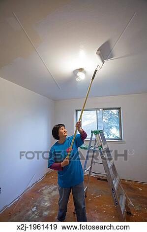 Stock Photograph Of Madison Heights Michigan Volunteers From Madison Heights Michigan Volunteers From Mercedes Benz Financial Services Help Re Habilitate A Habitat For Humanity House Low Income Family