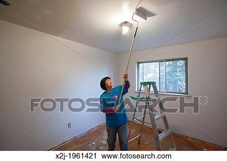Stock Photography Of Madison Heights Michigan Volunteers From Madison Heights Michigan Volunteers From Mercedes Benz Financial Services Help Re Habilitate A Habitat For Humanity House Low Income Family