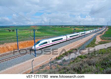 Madrid-Barcelona high-speed train traveling along La Alcarria. Guadalajara province, Castilla La Mancha, Spain. View Large Photo Image Stock Image - Madrid-Barcelona high-speed train traveling along La Alcarria. Guadalajara province, Castilla La Mancha, Spain.. Fotosearch