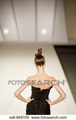 Madrid. IFEMA. Cibeles Madrid Fashion Week, FAll - Winter 09/10. Parade Juanjo Oliva. Model marching backwards View Large Photo Image Stock Photography - Madrid. IFEMA. Cibeles Madrid Fashion Week, FAll - Winter 09/10. Parade Juanjo Oliva. Model marching backwards. Fotosearch