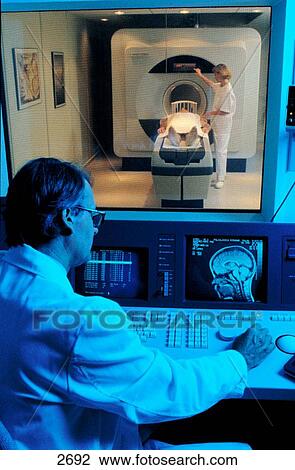 Stock Image - Magnetic resonance imaging unit from operator side. Fotosearch