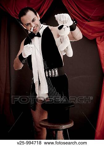 Stock Photo - Mago actuando en el circo. Fotosearch