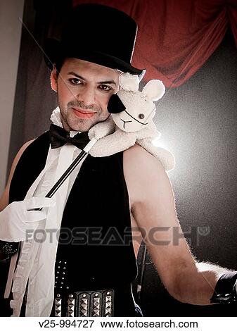 Mago actuando en el circo View Large Photo Image Stock Photo - Mago actuando en el circo. Fotosearch
