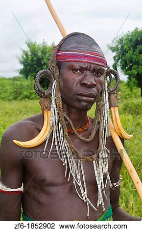 Stock Image - Mago National Park Ethiopia Africa Mursi tribe man Lower Omo Valley tradition tribal wild pottery 15. Fotosearch