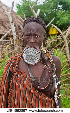 Stock Photo - Mago National Park Ethiopia Africa Mursi tribe women Lower Omo Valley with clay pots in lips tradition tribal wild pottery 15. Fotosearch