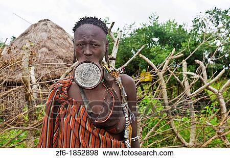 Stock Photo - Mago National Park Ethiopia Africa Mursi tribe women Lower Omo Valley with clay pots in lips tradition tribal wild pottery 15. Fotosearch