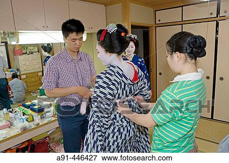 Stock Photo - ? Maikos? (geisha apprentice) from the Odamoto tea house (o-chaia) in Gion, Kyoto. Kansai, Japan. Fotosearch