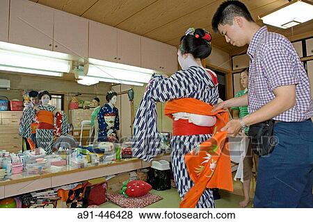 Stock Photo - ? Maikos? (geisha apprentice) from the Odamoto tea house (o-chaia) in Gion, Kyoto. Kansai, Japan. Fotosearch