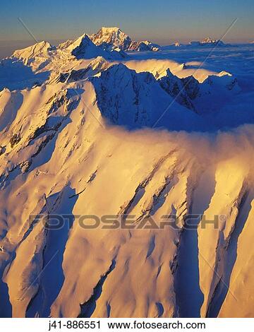 Stock Image - Main divide of Southern Alps at the head of the Landsborough River Mt Cook behind Westland National Park New Zealand. Fotosearch