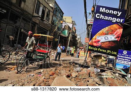 Main shopping street Paharganj where is front of New Delhi satiation, is on big road work Width of the street got wider All the shops facing to the street had to break down couple of meters of the buildings from the street, Delhi India View Large Photo Image Stock Image - Main shopping street Paharganj where is front of New Delhi satiation, is on big road work Width of the street got wider All the shops facing to the street had to break down couple of meters of the buildings from the street, Delhi India. Fotosearch