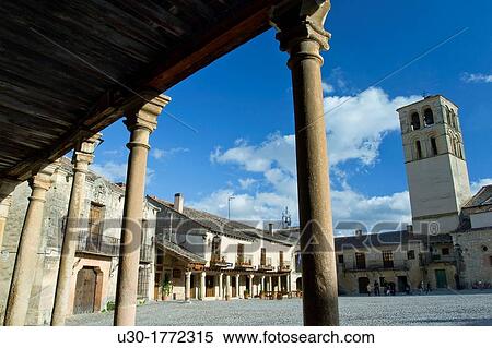 Main Square and romanesque church of San Juan Bautista in Pedraza, walled medieval village declarated Historical-Artistic Site Segovia province Castilla y Le? n Spain View Large Photo Image Stock Photography - Main Square and romanesque church of San Juan Bautista in Pedraza, walled medieval village declarated Historical-Artistic Site Segovia province Castilla y Le? n Spain. Fotosearch