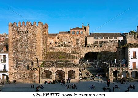 Main Square, Bujaco tower -12th century and Hermitage of the Peace -18th century, Caceres, Region of Extremadura, Spain. View Large Photo Image Stock Photo - Main Square, Bujaco tower -12th century and Hermitage of the Peace -18th century, Caceres, Region of Extremadura, Spain.. Fotosearch