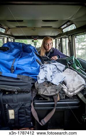 MaineYoung woman packing camping gear in classic SUV Acadia National Park, Maine USA View Large Photo Image Stock Image - MaineYoung woman packing camping gear in classic SUV Acadia National Park, Maine USA. Fotosearch