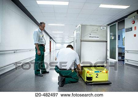 Maintenance employees, robot and trolley for intern transport. Hospital Universitario Gran Canaria Doctor Negrin, Las Palmas de Gran Canaria. Canary Islands, Spain View Large Photo Image Stock Photo - Maintenance employees, robot and trolley for intern transport. Hospital Universitario Gran Canaria Doctor Negrin, Las Palmas de Gran Canaria. Canary Islands, Spain. Fotosearch