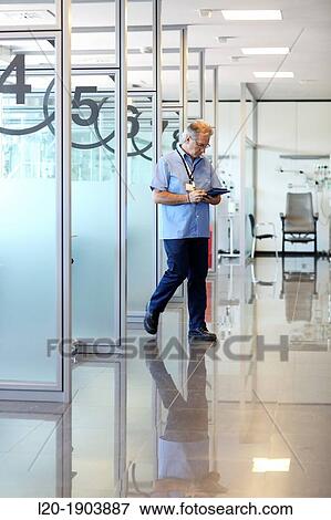 Stock Photo - Maintenance Technician, boxes chemotherapy, Onkologikoa Hospital, Oncology Institute, Case Center for prevention, diagnosis and treatment of cancer, Donostia, San Sebastian, Gipuzkoa, Basque Country, Spain. Fotosearch