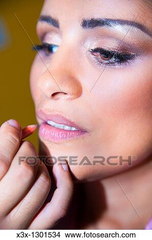 Picture - Make up artist applying lips liner. Fotosearch