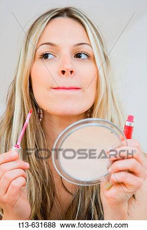 Make up girl grimacing View Large Photo Image Stock Photo - Make up girl grimacing. Fotosearch