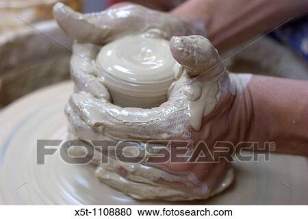 Making a clay pot on a potter's wheel View Large Photo Image Stock Image - Making a clay pot on a potter's wheel. Fotosearch