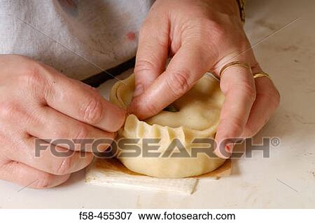 Stock Photo - Making a green peas? empanada?. Bakery of Porreres. Mallorca. Balearic Islands. Spain.. Fotosearch