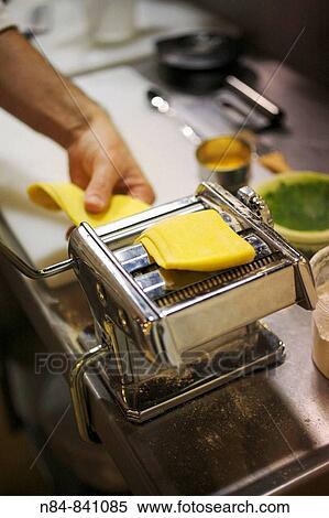 Making a home-made pasta using pasta maker View Large Photo Image Stock Photography - Making a home-made pasta using pasta maker. Fotosearch