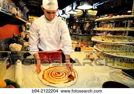 Making pizzas. The Mercat de Sant Josep de la Boqueria, aka La Boqueria, large public market with an entrance from La Rambla, not far from the Liceu, Barcelona's opera house. Ciutat Vella district of Barcelona, Catalonia, Spain View Large Photo Image Picture - Making pizzas. The Mercat de Sant Josep de la Boqueria, aka La Boqueria, large public market with an entrance from La Rambla, not far from the Liceu, Barcelona's opera house. Ciutat Vella district of Barcelona, Catalonia, Spain. Fotosearch