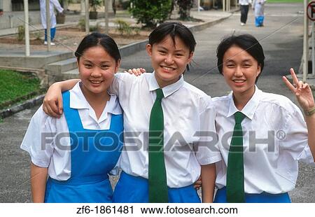 Malaysia, Kuala Lumpur, Portrait of school girls on street View Large Photo Image Stock Image - Malaysia, Kuala Lumpur, Portrait of school girls on street. Fotosearch