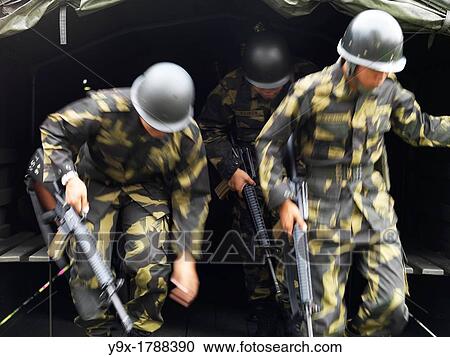 Malaysian infantry soldiers jumping out of a transport truck View Large Photo Image Stock Image - Malaysian infantry soldiers jumping out of a transport truck. Fotosearch