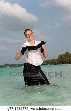 Maldives Islands Ari Atoll Business woman in sea. View Large Photo Image Picture - Maldives Islands Ari Atoll Business woman in sea.. Fotosearch