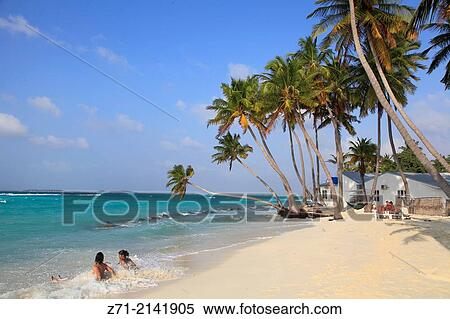 Stock Photography - Maldives, Maafushi Island, beach, palms, people,.. Fotosearch