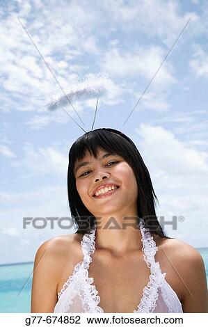 Stock Image - Maldives. South Male Atoll. Asian Woman.. Fotosearch