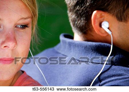 male and female listening to music together View Large Photo Image Stock Image - male and female listening to music together. Fotosearch
