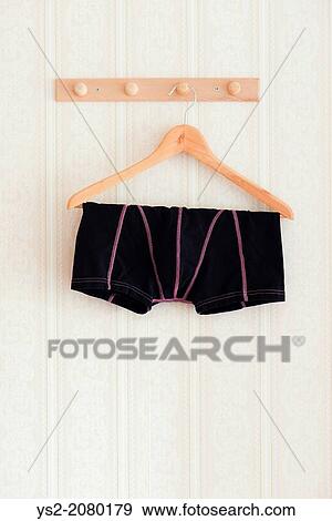 Male black boxer shorts hanging on a clothes hanger. View Large Photo Image Stock Photo - Male black boxer shorts hanging on a clothes hanger.. Fotosearch