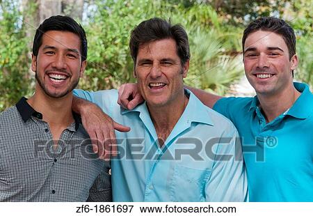 Male buddies friends in park portrait aged 30s and 40s in sunshine View Large Photo Image Stock Photo - Male buddies friends in park portrait aged 30s and 40s in sunshine. Fotosearch