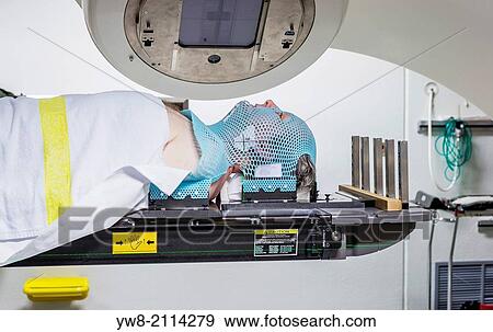 Male cancer patient lying under a linear accelerator or linac receiving radiation treatment. View Large Photo Image Stock Photo - Male cancer patient lying under a linear accelerator or linac receiving radiation treatment.. Fotosearch