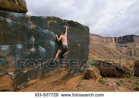Male climber bouldering at Big Bend area near Moab, Utah, USA View Large Photo Image Stock Photo - Male climber bouldering at Big Bend area near Moab, Utah, USA. Fotosearch