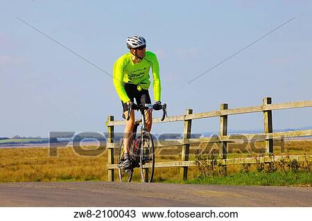 Male Cyclist on the Hadrian's Wall Route Burgh Marsh Cumbria England United Kingdom Great Britain. View Large Photo Image Stock Image - Male Cyclist on the Hadrian's Wall Route Burgh Marsh Cumbria England United Kingdom Great Britain.. Fotosearch