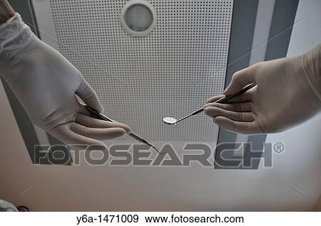 Male dentist with dental equipment View Large Photo Image Stock Photo - Male dentist with dental equipment. Fotosearch