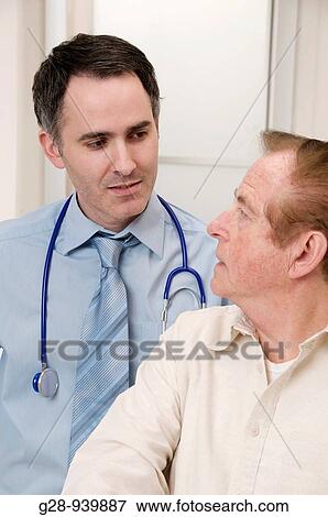 male doctor and senior male patient during a medical examination View Large Photo Image Stock Photo - male doctor and senior male patient during a medical examination. Fotosearch