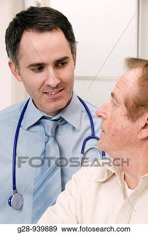 male doctor and senior male patient during a medical examination View Large Photo Image Stock Photo - male doctor and senior male patient during a medical examination. Fotosearch