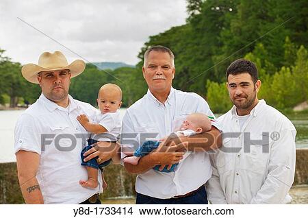 Male family portrait - grandfather, two sons and two baby grandsons View Large Photo Image Picture - Male family portrait - grandfather, two sons and two baby grandsons. Fotosearch