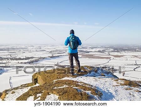 Male hiker on summit of Roseberry Topping near Great Ayton, North York Moors National Park, England, United Kingdon View Large Photo Image Stock Image - Male hiker on summit of Roseberry Topping near Great Ayton, North York Moors National Park, England, United Kingdon. Fotosearch