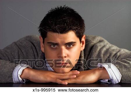 Male model chin resting on hands View Large Photo Image Stock Photography - Male model chin resting on hands. Fotosearch