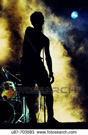 Male rock star performing View Large Photo Image Stock Image - Male rock star performing. Fotosearch