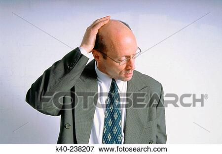 Man, 40-45, in suit, with concerned look View Large Photo Image Stock Photo - Man, 40-45, in suit, with concerned look. Fotosearch