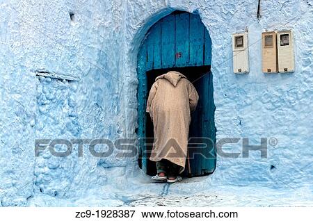Man about to come in his house Chefchaouen, Rif region, Morocco View Large Photo Image Stock Photo - Man about to come in his house Chefchaouen, Rif region, Morocco. Fotosearch