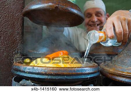 Man adding water into tagine pot Medina old quarter Casablanca central Morocco northern Africa View Large Photo Image Stock Image - Man adding water into tagine pot Medina old quarter Casablanca central Morocco northern Africa. Fotosearch